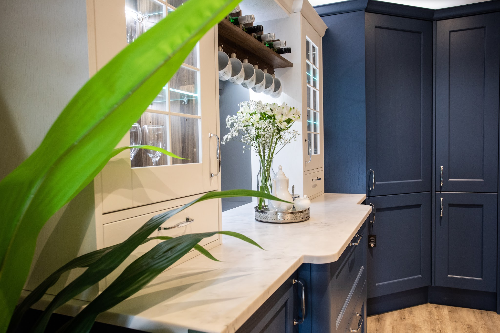 Cream and navy shaker kitchen with a glazed dresser unit