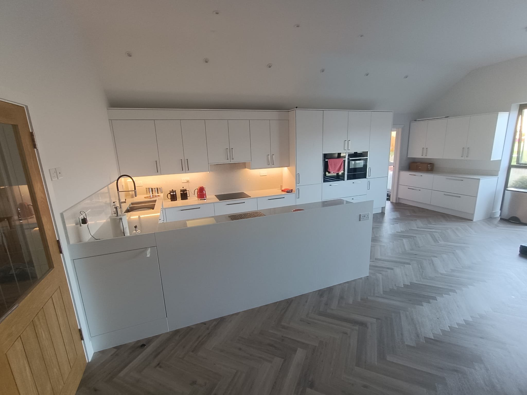 Open-plan kitchen after, fitted by Atlantic